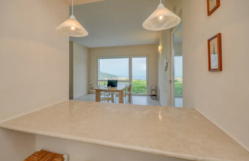 View from the kitchen towards the dining area and its lake-facing window
